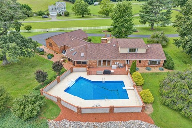 Discover a rare riverside haven: a sprawling 4-bedroom, 4-bath