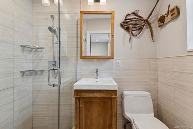 Just 1 block from the beach, this beautifully updated and