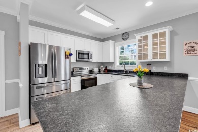 This furnished 3-bedroom, 2-bath condo offers beach living at