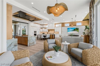 Overlooking the pristine sands of Fort Myers Beach, this BRAND