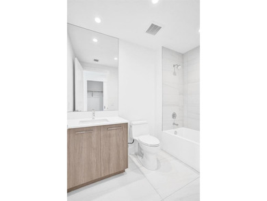 Experience elevated coastal living in this stunning residence