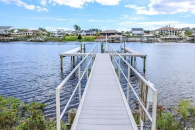 Experience luxury waterfront living in this exquisite all-brick