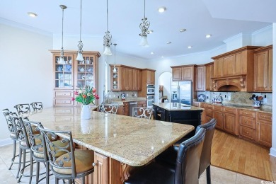 Experience luxury waterfront living in this exquisite all-brick