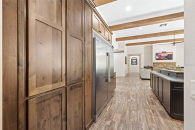 Welcome to 22220 Deer Park Avenue, a single-story custom estate