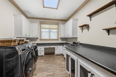 Welcome to 22220 Deer Park Avenue, a single-story custom estate