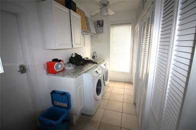 Charming waterfront living in South Coral Gables. Canal front