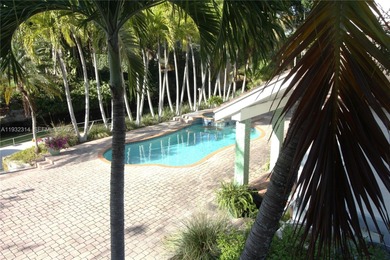 Charming waterfront living in South Coral Gables. Canal front