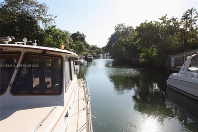 Charming waterfront living in South Coral Gables. Canal front