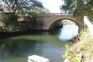 Charming waterfront living in South Coral Gables. Canal front