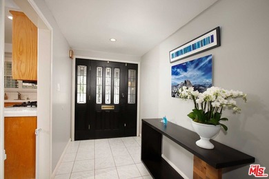 This beautifully designed and well-cared-for 4-bedroom, 2-bath