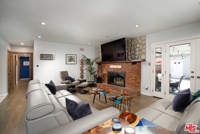 This beautifully designed and well-cared-for 4-bedroom, 2-bath