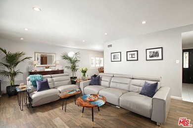 This beautifully designed and well-cared-for 4-bedroom, 2-bath