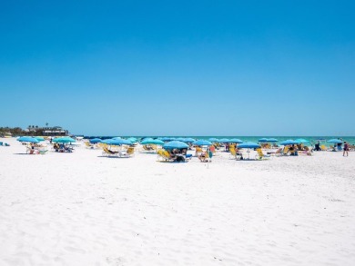 Welcome to luxurious, maintenance-free beachfront living at