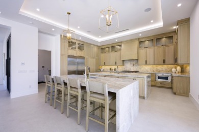 This extraordinary new-construction waterfront estate offers a