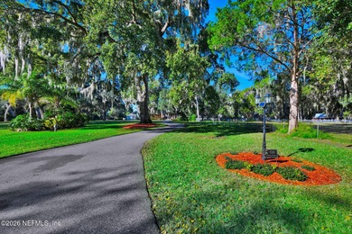 A distinguished riverfront home privately set beyond a majestic