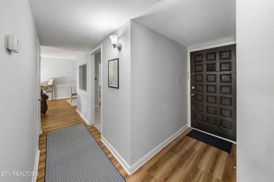 This beautifully updated 2-bedroom corner unit on the main level