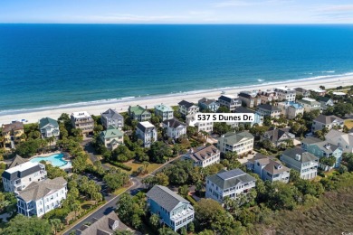 Beach-style Splendor! Welcome to 537 S Dunes Drive, an elegant