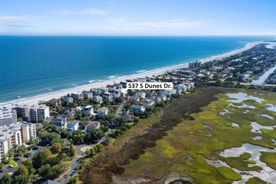 Beach-style Splendor! Welcome to 537 S Dunes Drive, an elegant