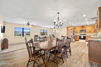 Welcome to this charming 2-bedroom, 2-bath home on a half-acre