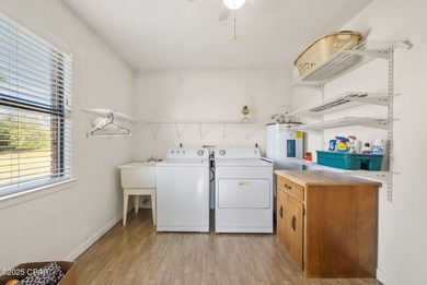 Welcome to this charming 2-bedroom, 2-bath home on a half-acre