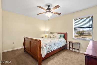 Welcome to this charming 2-bedroom, 2-bath home on a half-acre