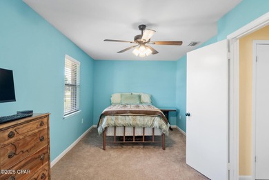 Welcome to this charming 2-bedroom, 2-bath home on a half-acre