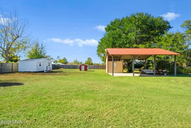 Welcome to this charming 2-bedroom, 2-bath home on a half-acre