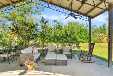 Welcome to this charming 2-bedroom, 2-bath home on a half-acre