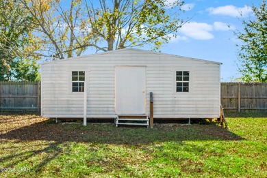 Welcome to this charming 2-bedroom, 2-bath home on a half-acre