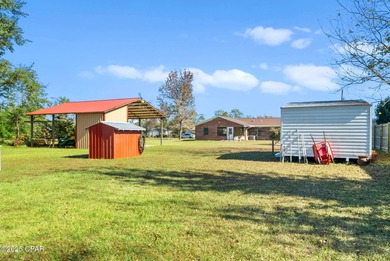 Welcome to this charming 2-bedroom, 2-bath home on a half-acre