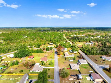 Welcome to this charming 2-bedroom, 2-bath home on a half-acre