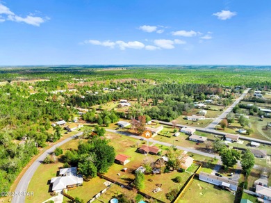 Welcome to this charming 2-bedroom, 2-bath home on a half-acre