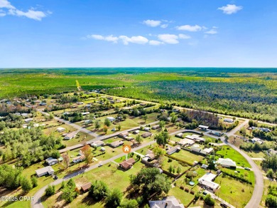 Welcome to this charming 2-bedroom, 2-bath home on a half-acre