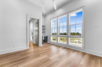 This new construction, six-bedroom, six-bathroom Gulf-front home