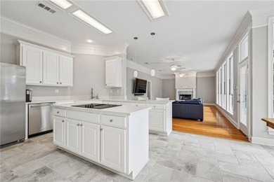 Charming and updated, this Old Mandeville beauty is tucked