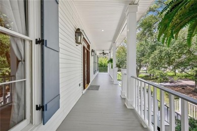 Charming and updated, this Old Mandeville beauty is tucked