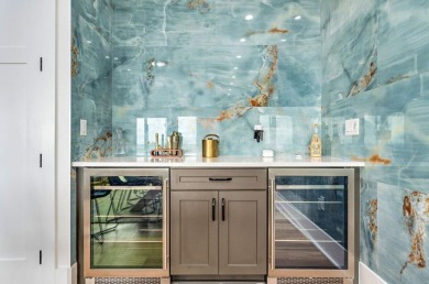 This exclusive luxury 8 BR/ 8.5 BA beachfront home is not just a