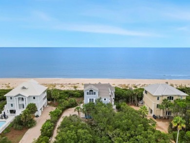 A Beautiful Towering 5 Bedroom Beachfront home located on the