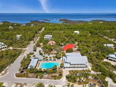 A Beautiful Towering 5 Bedroom Beachfront home located on the
