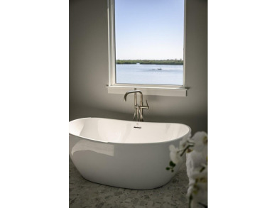 Brand New luxury construction at gated Grand Harbor! Enjoy true