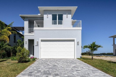 Brand New luxury construction at gated Grand Harbor! Enjoy true