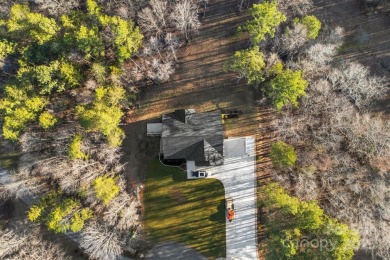 Nestled on 2.24 acres, this exceptional custom-built home offers