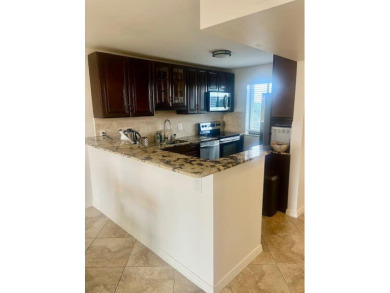 Don't miss This beautifully updated 2/2 penthouse condo