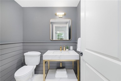 Set within the gates of the Aquidneck Club, this exquisitely and