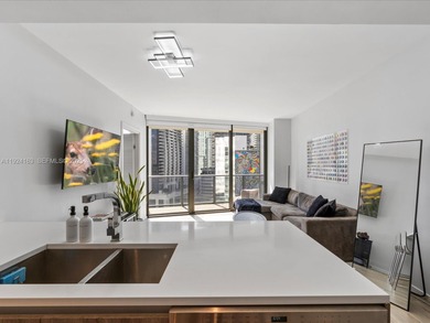 High above Brickell, this stunning SLS LUX residence offers a