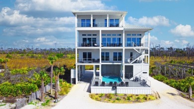 A SHOWSTOPPER of a home! Located in Secluded Dunes subd. This