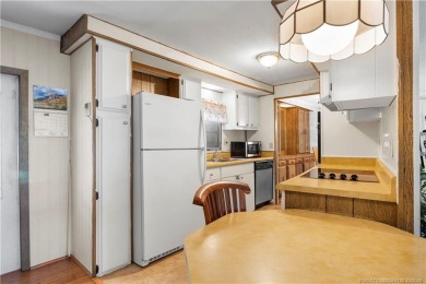 Charming mobile home on a cul-de-sac with a fenced yard and