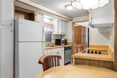 Charming mobile home on a cul-de-sac with a fenced yard and