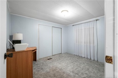 Charming mobile home on a cul-de-sac with a fenced yard and