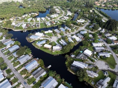 Charming mobile home on a cul-de-sac with a fenced yard and
